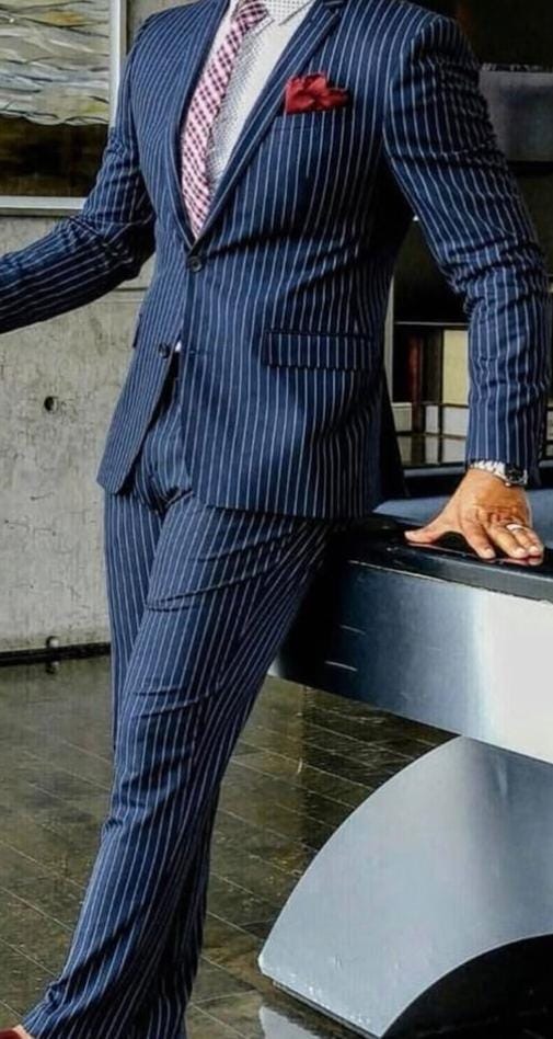Dark blue pinstripe suit with pocket square